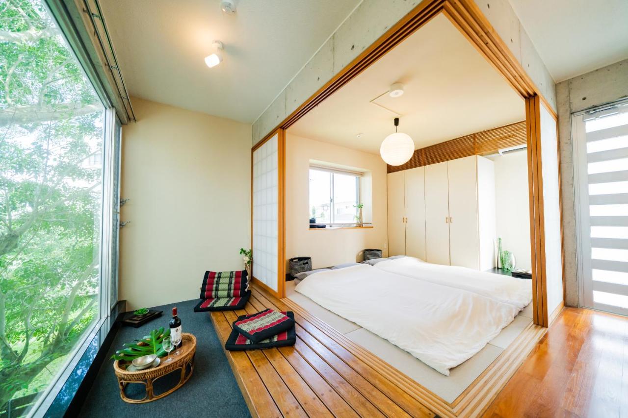 Em Tree House Villa Uruma Eksteriør bilde