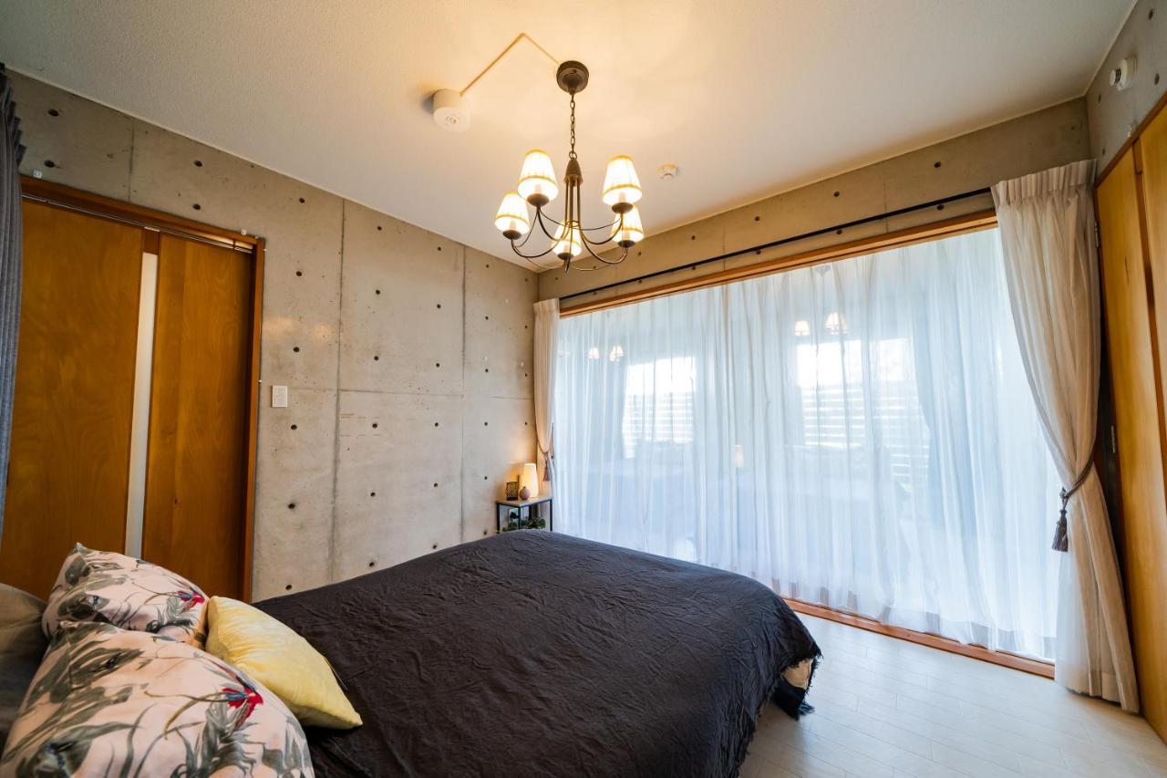 Em Tree House Villa Uruma Eksteriør bilde