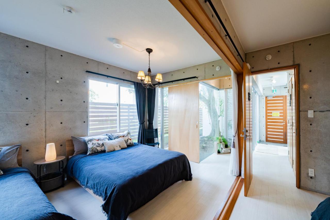 Em Tree House Villa Uruma Eksteriør bilde