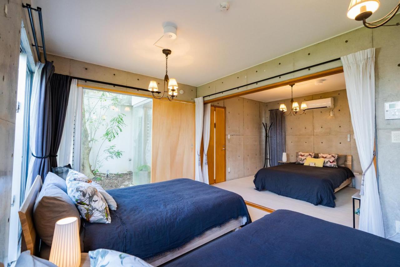 Em Tree House Villa Uruma Eksteriør bilde