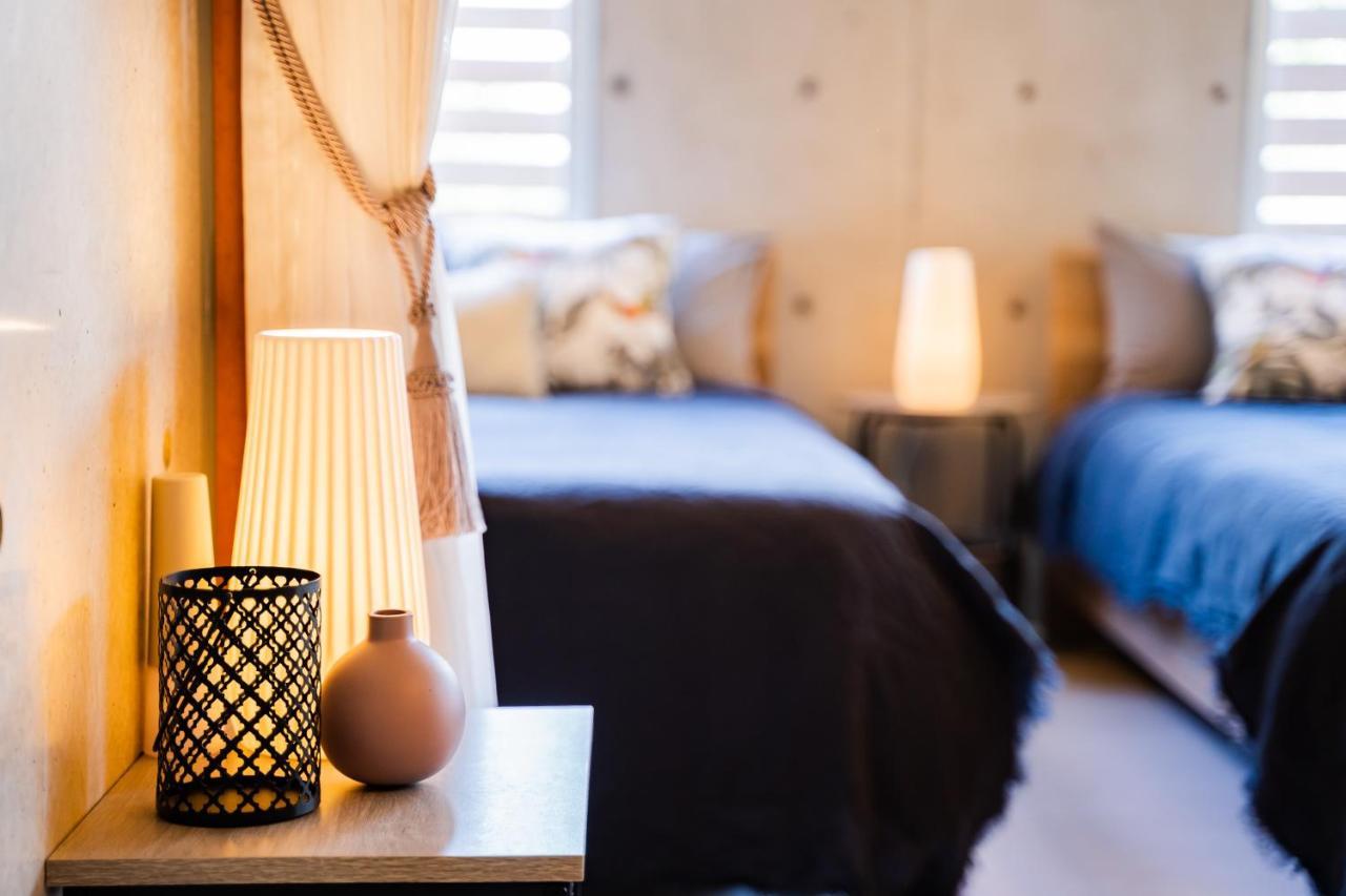 Em Tree House Villa Uruma Eksteriør bilde